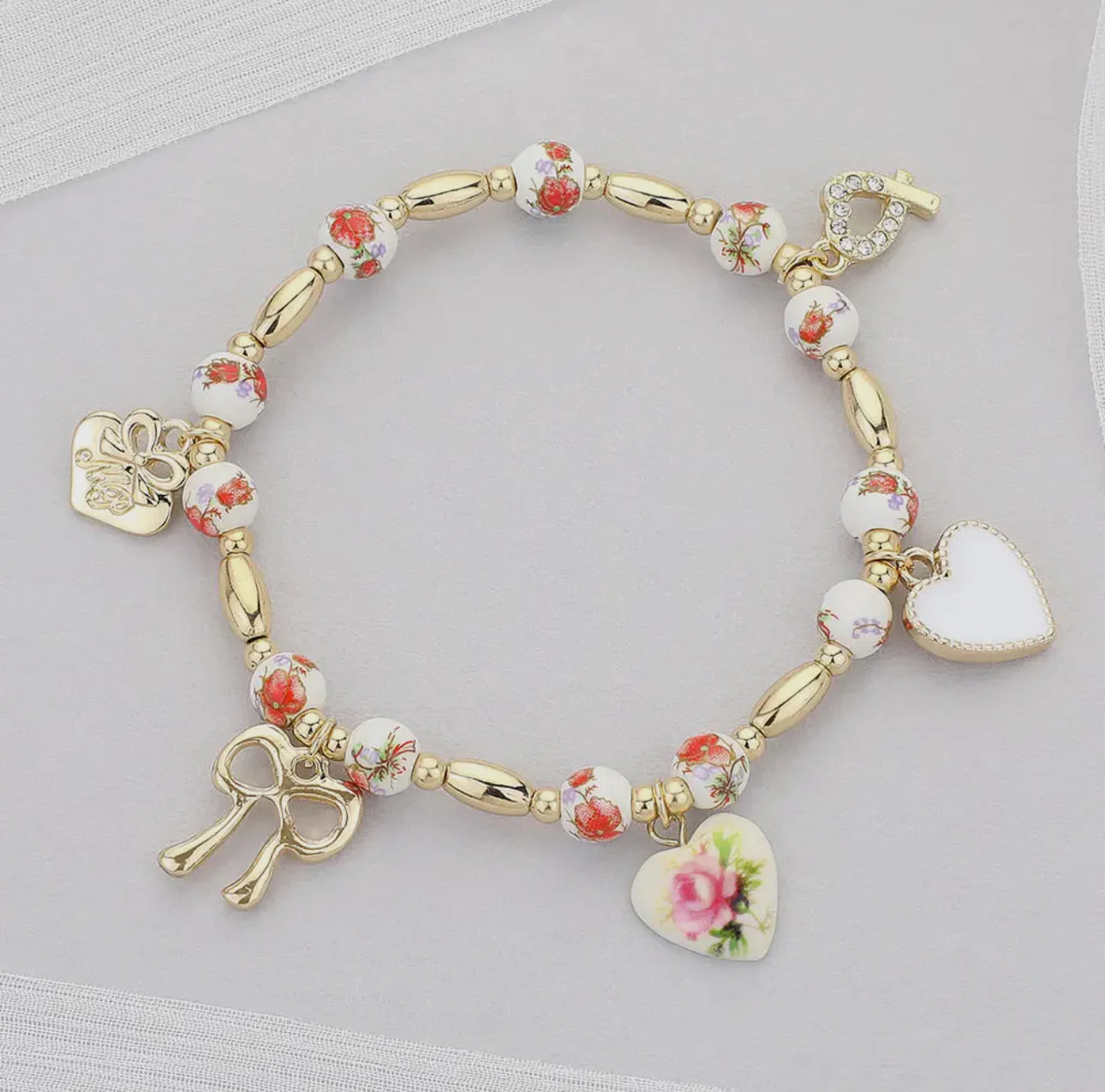 Floral heart and bow charm stretch bracelet